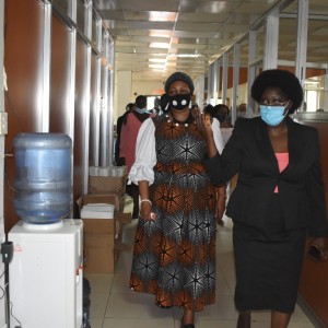 Ag. Secretary Ms. Ejang (R) shows the new UHRC chairperson Ms. Wangadya (L) the offices on third floor of the UHRC headquarters on Twed Plaza