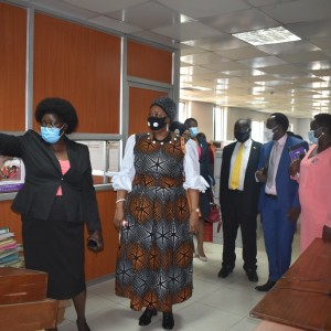 Ag. Secretary Ms. Margaret Ejang (L) showing the new Chairperson UHRC Ms. Wangadya and Commissioners_ Fr. Simon Lokodo (Yellow tie), Mr. c. Kaheru and Ms. J. Atuhaire